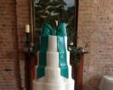 White wedding cake trimmed with Teal Bow.