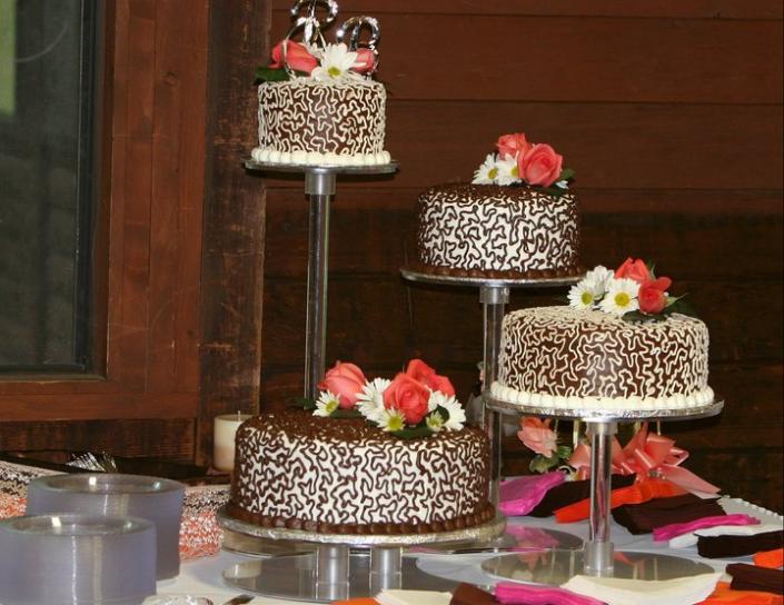 Beautiful chocolate wedding cake with fresh flowers